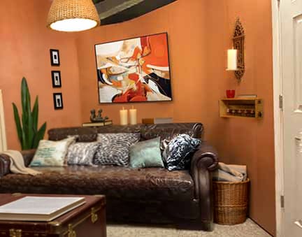 Den made with curved and straight portable walls plus portable wall with door.